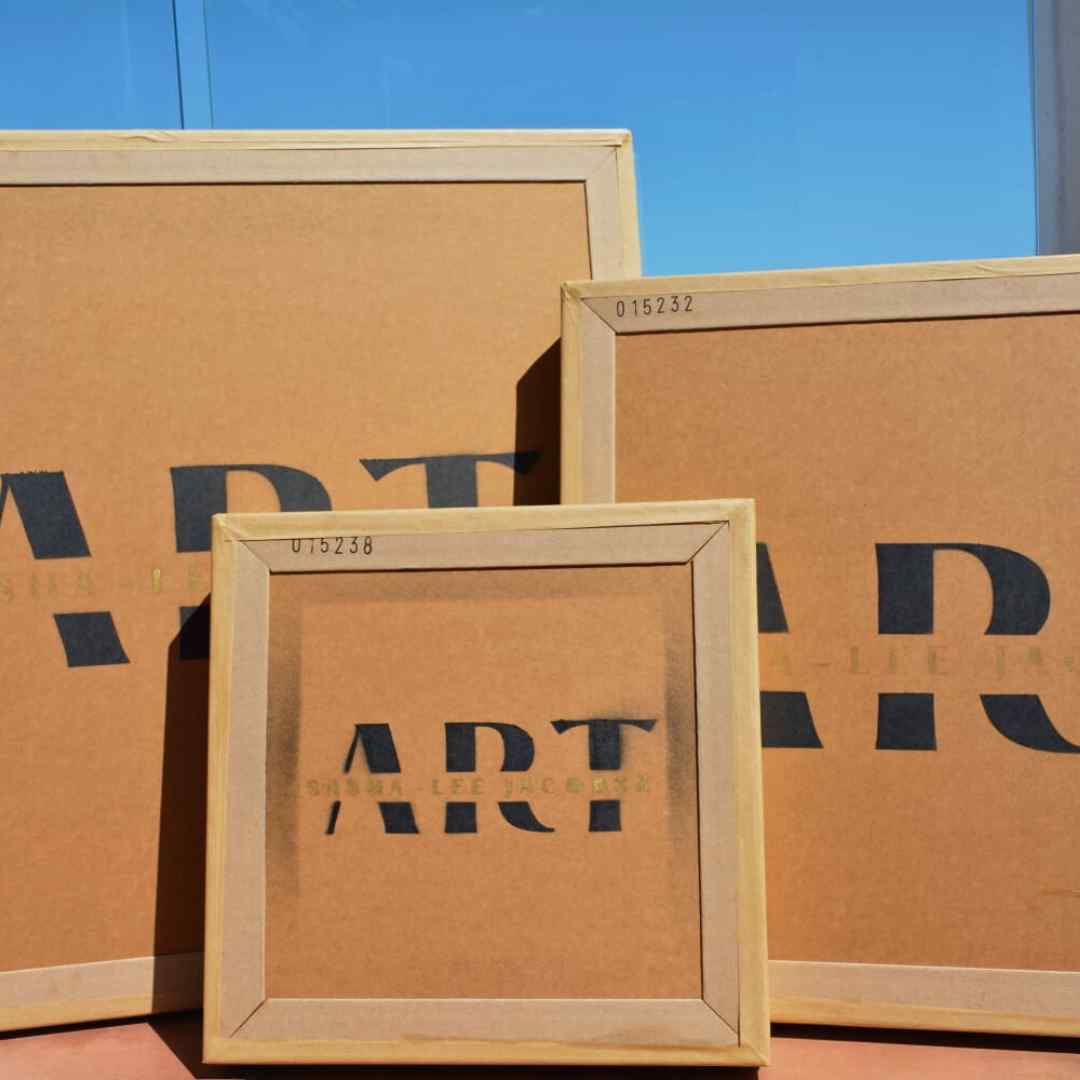 Three custom art packaging boxes with 'ART' label