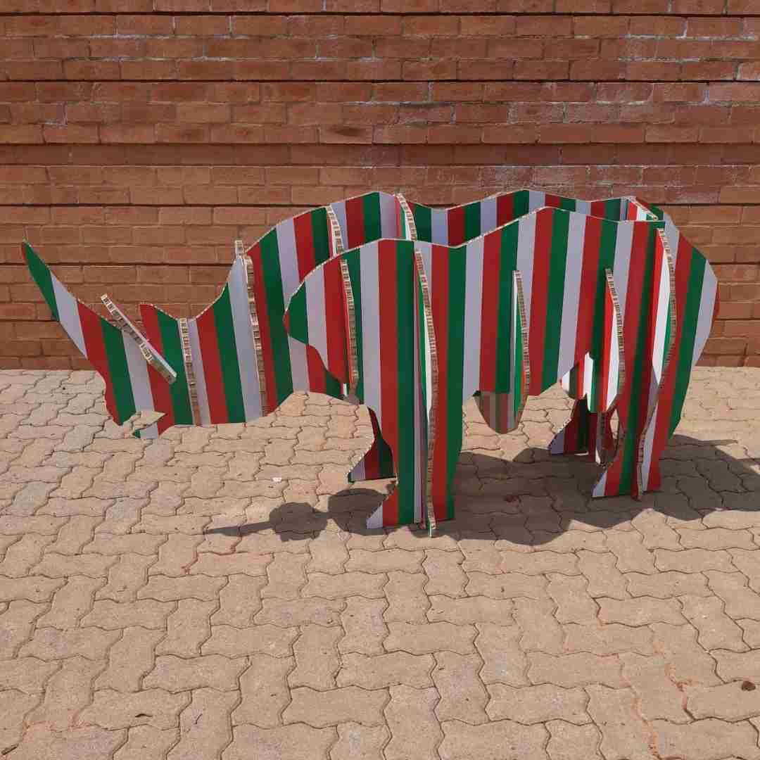 Colorful rhino sculpture made from honeycomb boards as an alternative to wood and timber boards, illustrating the lightweight and versatile properties of honeycomb boards in creative applications