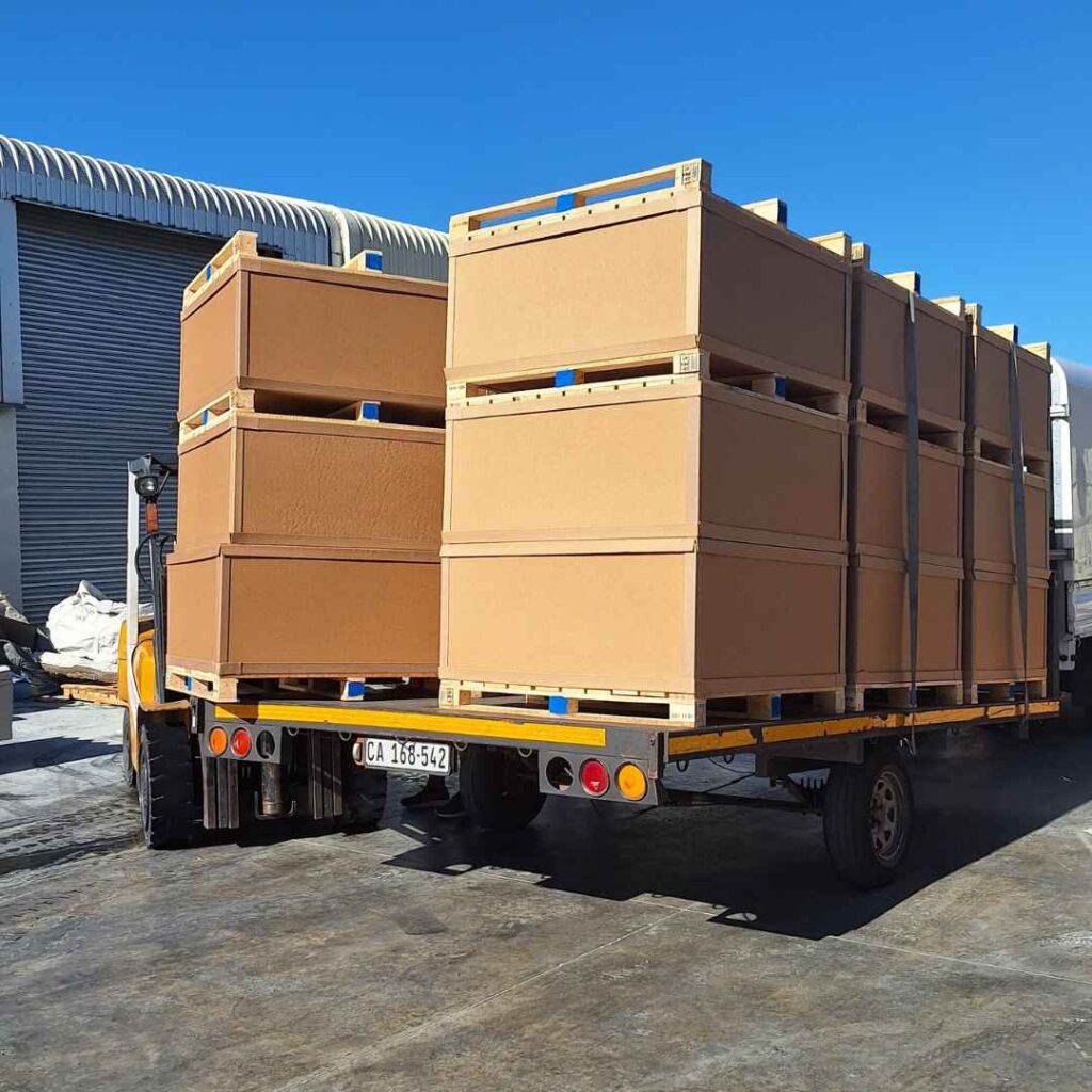 Custom industrial crates prepared outside a warehouse for safe transport