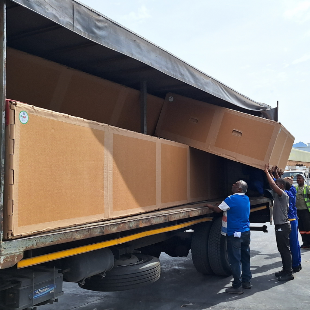 Industrial crate being loaded onto a truck for safe product transport