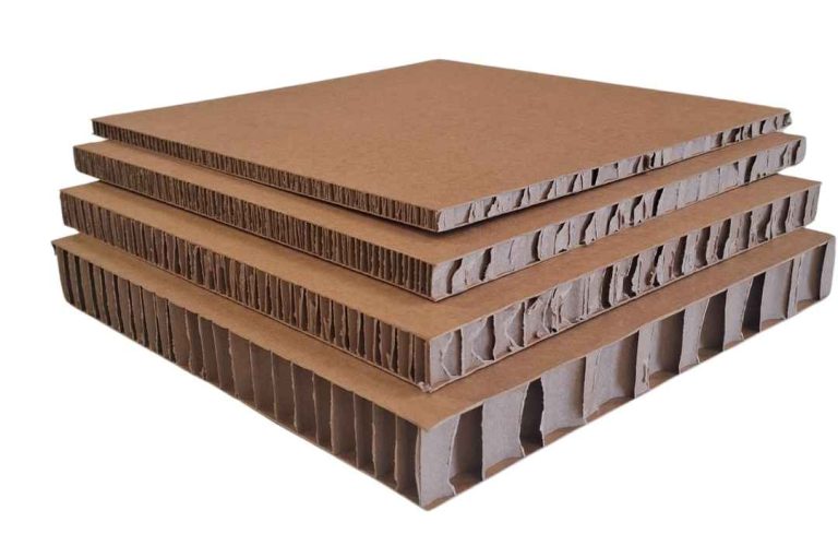 Stacked kraft honeycomb board panels showing exposed honeycomb core structure in multiple thicknesses, lightweight paper-based honeycomb panels for packaging and industrial applications.