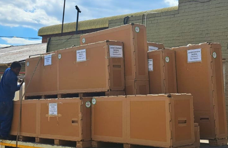 Heavy machinery packed inside industrial export crates ready for international freight.
