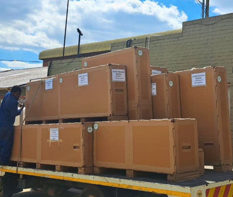 Heavy machinery packed inside industrial export crates ready for international freight.