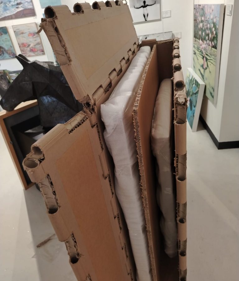 Protective packaging around framed artwork
